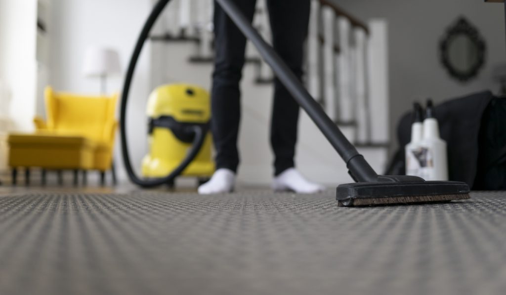 vaccuming the carpet